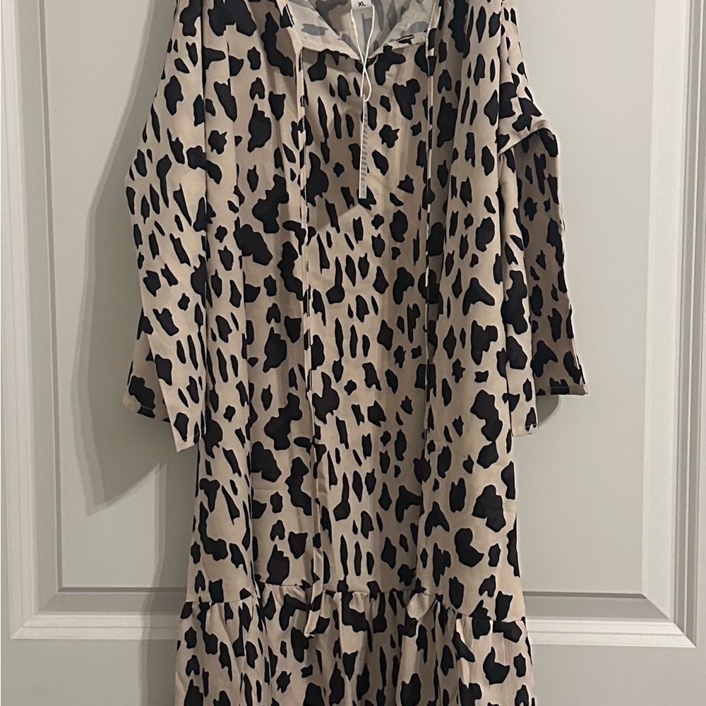 Leopard Print Dress with Cold Shoulder and 3/4 Sleeves. Looks good on everybody!
